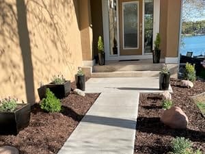 Walkway with mulch surrounding it